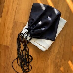 Two Drawstring bags useful for carrying the tennis racquet